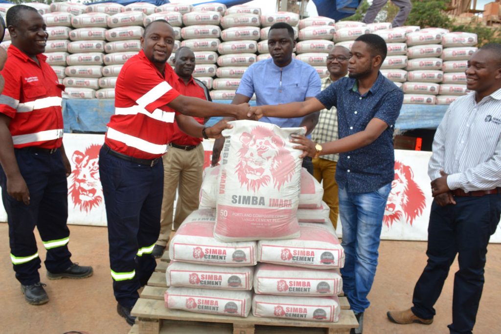 Tanga Cement PLC hand over 300 bags of Simba Cement to Holili ward